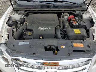 2012 Ford Taurus SHO with VIN 1FAHP2KT2CG141879, listed as a Copart auction lot 56558365 with 105,230 mi miles and Salvage title. Bid and sale history available at DreamBid. Image 11.