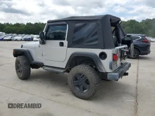 2005 Jeep Wrangler X with VIN 1J4FA39S55P353789, listed as a Copart auction lot 62469015 with 143,817 mi miles and Salvage title. Bid and sale history available at DreamBid. Image 2.