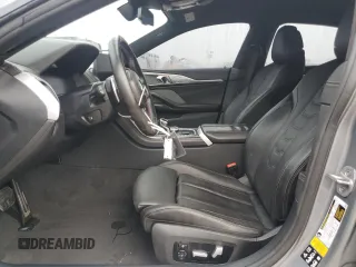 2023 BMW 8 Series M850i z VIN WBAGV8C02PCL20503, wystawiony jako Copart lot #84214214 z przebiegiem Nie podano mil oraz Szkoda całkowita • Salvage title. Historia ofert i sprzedaży dostępna na DreamBid. Obrazek 7.