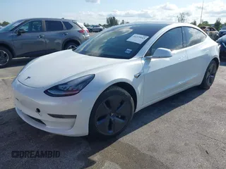 2020 Tesla Model 3 Standard Range Plus with VIN 5YJ3E1EA6LF799620, listed as a IAAI auction lot 42221643 with 55,458 mi miles and . Bid and sale history available at carsss.com. Image 18.