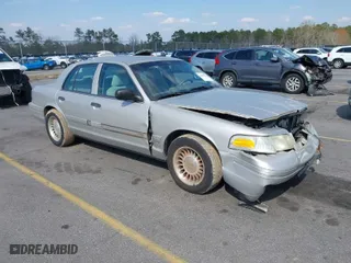 2004 Ford Crown Victoria Standard with VIN 2FAFP73W94X107561, listed as a IAAI auction lot 41804985 with 128,066 mi miles. Bid and sale history available at carsss.com. Image 1.