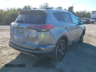 2018 Toyota RAV4 XLE with VIN JTMWFREV7JD125119, listed as a IAAI auction lot 41841021 with 132,659 mi miles and . Bid and sale history available at DreamBid. Image 4.