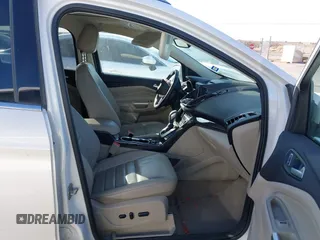 2016 Ford Escape Titanium with VIN 1FMCU0J96GUB36680, listed as a IAAI auction lot 41446705 with 137,926 mi miles. Bid and sale history available at carsss.com. Image 5.