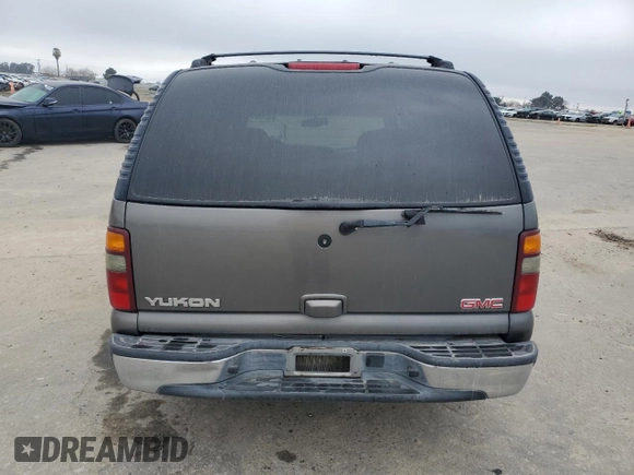 2002 GMC Yukon SLE z VIN 1GKEC13V52J192656, wystawiony jako Copart lot #46674605 z przebiegiem 258 336 mil mil oraz Szkoda całkowita • Salvage title. Historia ofert i sprzedaży dostępna na DreamBid. Obrazek 6.