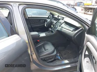 2012 Ford Taurus SEL z VIN 1FAHP2EWXCG138038, wystawiony jako IAAI lot #42007614 z przebiegiem 155 045 mil mil oraz . Historia ofert i sprzedaży dostępna na DreamBid. Obrazek 5.