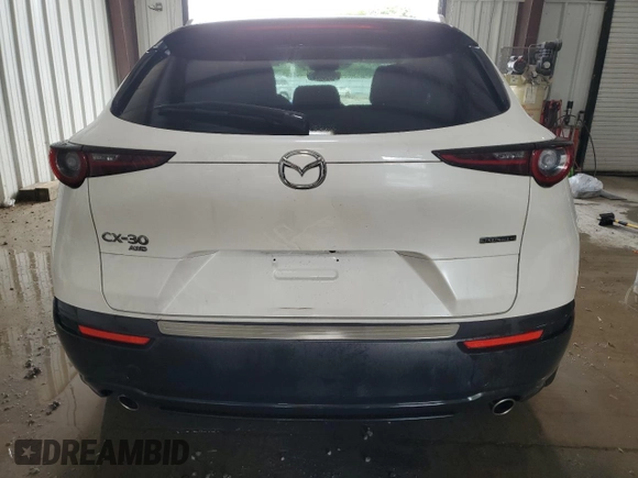 2023 Mazda CX-30 S Select z VIN 3MVDMBBM2PM521471, wystawiony jako Copart lot #63272965 z przebiegiem 26 879 mil mil oraz Szkoda całkowita • Salvage title. Historia ofert i sprzedaży dostępna na DreamBid. Obrazek 6.