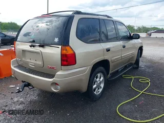 2005 GMC Envoy SLT with VIN 1GKDS13S452141376, listed as a IAAI auction lot 42095025 with 198,911 mi miles and . Bid and sale history available at DreamBid. Image 4.