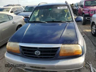 2003 Suzuki Grand Vitara z VIN JS3TE62V534100751, wystawiony jako Copart lot #76714894 z przebiegiem Nie podano mil oraz Nie do naprawy • Non repairable. Historia ofert i sprzedaży dostępna na DreamBid. Obrazek 5.