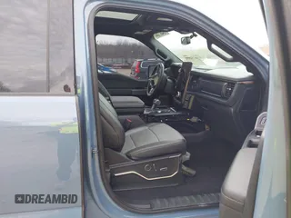 2023 Ford F-150 Lightning Pro with VIN 1FT6W1EVXPWG34958, listed as a IAAI auction lot 41732898 with 10,573 mi miles and . Bid and sale history available at DreamBid. Image 5.