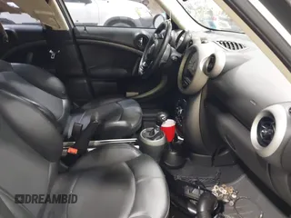 2012 MINI Countryman S with VIN WMWZC5C58CWL60067, listed as a IAAI auction lot 42081725 with 104,397 mi miles and . Bid and sale history available at DreamBid. Image 5.