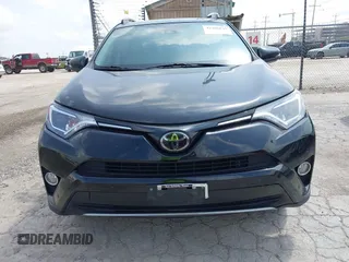 2018 Toyota RAV4 XLE z VIN 2T3WFREV4JW495379, wystawiony jako IAAI lot #42406849 z przebiegiem 132 126 mil mil oraz . Historia ofert i sprzedaży dostępna na DreamBid. Obrazek 13.