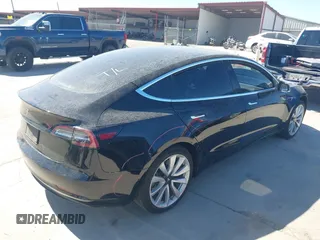 2020 Tesla Model 3 Standard Range Plus with VIN 5YJ3E1EAXLF614002, listed as a IAAI auction lot 41758898 with 42,363 mi miles and . Bid and sale history available at DreamBid. Image 4.