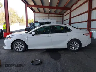 2020 Toyota Camry LE with VIN 4T1C11AK9LU935025, listed as a IAAI auction lot 42054033 with 63,814 mi miles and . Bid and sale history available at carsss.com. Image 14.