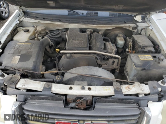 2004 GMC Envoy SLT z VIN 1GKDT13S242171925, wystawiony jako Copart lot #46262535 z przebiegiem 200 396 mil mil oraz Szkoda całkowita • Salvage title. Historia ofert i sprzedaży dostępna na DreamBid. Obrazek 14.