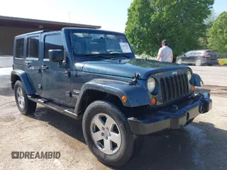2007 Jeep Wrangler Unlimited Sahara z VIN 1J4GA59167L215471, wystawiony jako IAAI lot #42043021 z przebiegiem 181 675 mil mil oraz . Historia ofert i sprzedaży dostępna na DreamBid. Obrazek 1.