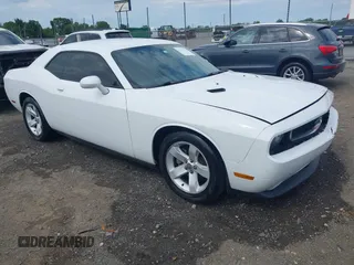 2012 Dodge Challenger SXT Plus z VIN 2C3CDYAG6CH254585, wystawiony jako IAAI lot #42282492 z przebiegiem 165 945 mil mil oraz . Historia ofert i sprzedaży dostępna na DreamBid. Obrazek 1.