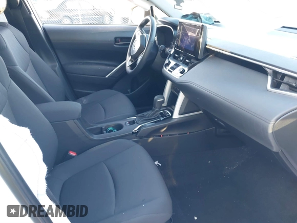 2024 Toyota Corolla Cross LE with VIN 7MUBAABG0RV097884, listed as a IAAI auction lot 41447543 with 8,396 mi miles and . Bid and sale history available at DreamBid. Image 5.