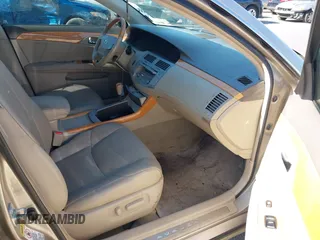 2007 Toyota Avalon XL with VIN 4T1BK36B57U241189, listed as a IAAI auction lot 42130640 with 144,735 mi miles. Bid and sale history available at carsss.com. Image 5.