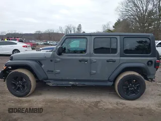 2021 Jeep Wrangler Unlimited Sport Altitude with VIN 1C4HJXDG1MW603784, listed as a IAAI auction lot 41509231 with 102,567 mi miles and . Bid and sale history available at DreamBid. Image 15.
