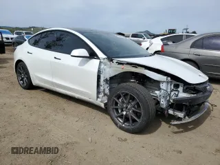 2022 Tesla Model 3 Long Range with VIN 5YJ3E1EB0NF123224, listed as a Copart auction lot 49890205 with 68,594 mi miles and Salvage Title. Bid and sale history available at DreamBid. Image 4.