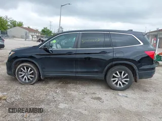 2020 Honda Pilot EX-L with VIN 5FNYF6H57LB059332, listed as a IAAI auction lot 42614422 with 110,279 mi miles and . Bid and sale history available at DreamBid. Image 14.