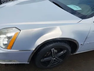 2006 Cadillac DTS w/1SC with VIN 1G6KD57Y56U101903, listed as a IAAI auction lot 41710160 with 151,057 mi miles. Bid and sale history available at carsss.com. Image 6.