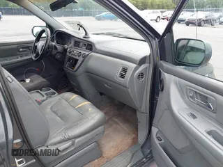 2003 Honda Odyssey EX-L with VIN 5FNRL18963B059910, listed as a IAAI auction lot 42415037 with 267,600 mi miles and . Bid and sale history available at DreamBid. Image 5.