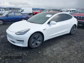 2018 Tesla Model 3 Long Range Battery with VIN 5YJ3E1EA3JF013253, listed as a IAAI auction lot 41752102 with 84,459 mi miles. Bid and sale history available at carsss.com. Image 21.
