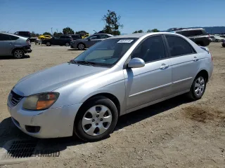 2009 Kia Spectra LX z VIN KNAFE222095613710, wystawiony jako Copart lot #58570115 z przebiegiem 114 172 mil mil oraz Szkoda całkowita • Salvage title. Historia ofert i sprzedaży dostępna na DreamBid. Obrazek 1.