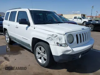 2011 Jeep Patriot Latitude with VIN 1J4NT1GB5BD245263, listed as a IAAI auction lot 41942376 with 215,147 mi miles. Bid and sale history available at carsss.com. Image 1.