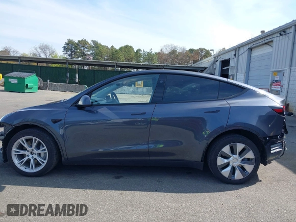 2023 Tesla Model Y Long Range with VIN 7SAYGDEE7PF856985, listed as a IAAI auction lot 42097675 with 13,112 mi miles and . Bid and sale history available at DreamBid. Image 15.