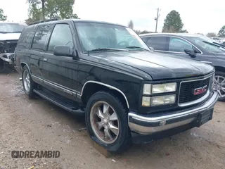 1998 GMC Yukon with VIN 1GKEC13R8WJ711255, listed as a IAAI auction lot 41457304 with 291,211 mi miles. Bid and sale history available at carsss.com. Image 1.