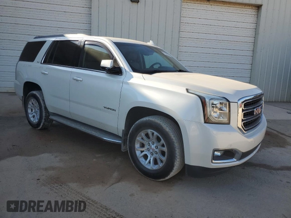 2015 GMC Yukon SLT with VIN 1GKS1BKCXFR563509, listed as a Copart auction lot 77188854 with 127,481 mi miles and Clean Title. Bid and sale history available at carsss.com. Image 4.