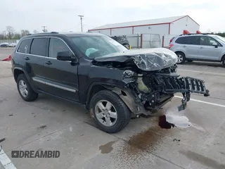 2011 Jeep Grand Cherokee Laredo with VIN 1J4RR4GG8BC504878, listed as a IAAI auction lot 42097973 with 190,583 mi miles and . Bid and sale history available at DreamBid. Image 1.
