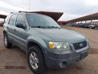 2006 Ford Escape XLT with VIN 1FMYU93136KD49887, listed as a IAAI auction lot 41819143 with 240,537 mi miles. Bid and sale history available at carsss.com. Image 1.