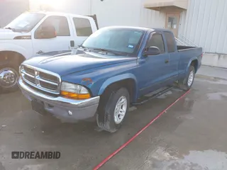 2003 Dodge Dakota SLT z VIN 1D7HL42N93S196397, wystawiony jako IAAI lot #42105857 z przebiegiem 159 690 mil mil oraz . Historia ofert i sprzedaży dostępna na DreamBid. Obrazek 2.