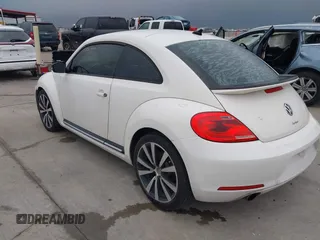 2012 Volkswagen Beetle Turbo with VIN 3VWVA7AT3CM650301, listed as a IAAI auction lot 41525503 with Not Provided miles and . Bid and sale history available at DreamBid. Image 3.