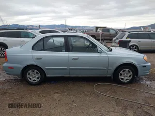 2003 Hyundai Accent GL with VIN KMHCG45C43U465523, listed as a IAAI auction lot 40883056 with 95,770 mi miles. Bid and sale history available at carsss.com. Image 13.