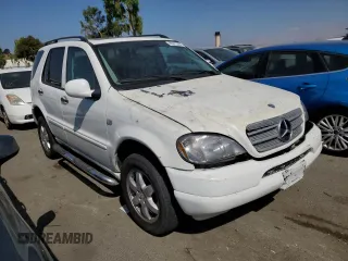 2000 Mercedes-Benz M-Class with VIN 4JGAB54E5YA165660, listed as a Copart auction lot 65872364 with 115,668 mi miles and Salvage Title. Bid and sale history available at carsss.com. Image 4.