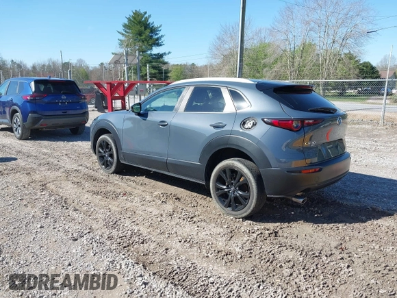 2023 Mazda CX-30 2.5 S Carbon Edition with VIN 3MVDMBCM5PM528946, listed as a IAAI auction lot 41882936 with 62,815 mi miles. Bid and sale history available at carsss.com. Image 3.