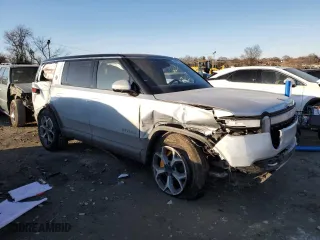 2023 Rivian R1S Adventure with VIN 7PDSGABAXPN008547, listed as a Copart auction lot 89061955 with 24,454 mi miles and Salvage Title. Bid and sale history available at carsss.com. Image 4.