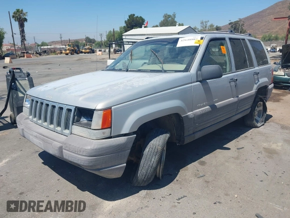 1997 Jeep Grand Cherokee Laredo z VIN 1J4GZ58S4VC720943, wystawiony jako IAAI lot #42648807 z przebiegiem 231 203 mil mil oraz . Historia ofert i sprzedaży dostępna na DreamBid. Obrazek 2.