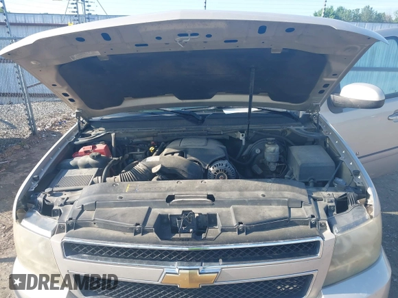 2007 Chevrolet Suburban LS with VIN 1GNFC16007J203853, listed as a IAAI auction lot 39454050 with 246,521 mi miles and . Bid and sale history available at DreamBid. Image 10.