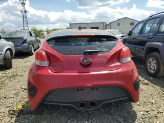 2016 Hyundai Veloster z VIN KMHTC6ADXGU256525, wystawiony jako Copart lot #55642405 z przebiegiem 163 377 mil mil oraz Szkody całkowita. Historia ofert i sprzedaży dostępna na DreamBid. Obrazek 6.
