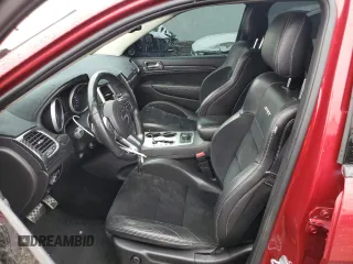 2012 Jeep Grand Cherokee SRT8 with VIN 1C4RJFDJ0CC351195, listed as a Copart auction lot 72794454 with 104,672 mi miles and Salvage Title. Bid and sale history available at carsss.com. Image 7.