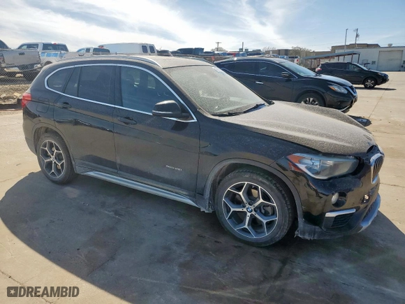 2018 BMW X1 sDrive28i with VIN WBXHU7C31J5H39068, listed as a Copart auction lot 49018985 with 100,611 mi miles and Salvage Title. Bid and sale history available at carsss.com. Image 4.