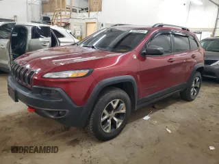 2015 Jeep Cherokee Trailhawk z VIN 1C4PJMBS9FW509642, wystawiony jako Copart lot #52385555 z przebiegiem 135 477 mil mil oraz Szkoda całkowita • Salvage title. Historia ofert i sprzedaży dostępna na DreamBid. Obrazek 1.
