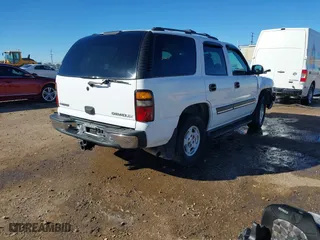 2004 Chevrolet Tahoe LT with VIN 1GNEC13Z44R323201, listed as a IAAI auction lot 41481138 with 216,869 mi miles. Bid and sale history available at carsss.com. Image 4.