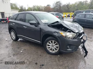 2014 Mazda CX-5 Touring z VIN JM3KE2CY3E0317437, wystawiony jako IAAI lot #42212083 z przebiegiem 126 592 mil mil oraz . Historia ofert i sprzedaży dostępna na DreamBid. Obrazek 1.