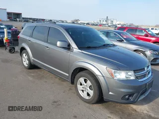2012 Dodge Journey SXT z VIN 3C4PDCBG9CT208092, wystawiony jako IAAI lot #42065471 z przebiegiem 208 794 mil mil oraz . Historia ofert i sprzedaży dostępna na DreamBid. Obrazek 1.